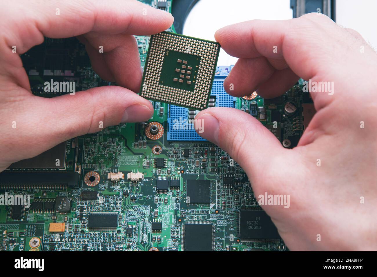 Analysis , installing of processor in CPU socket Stock Photo