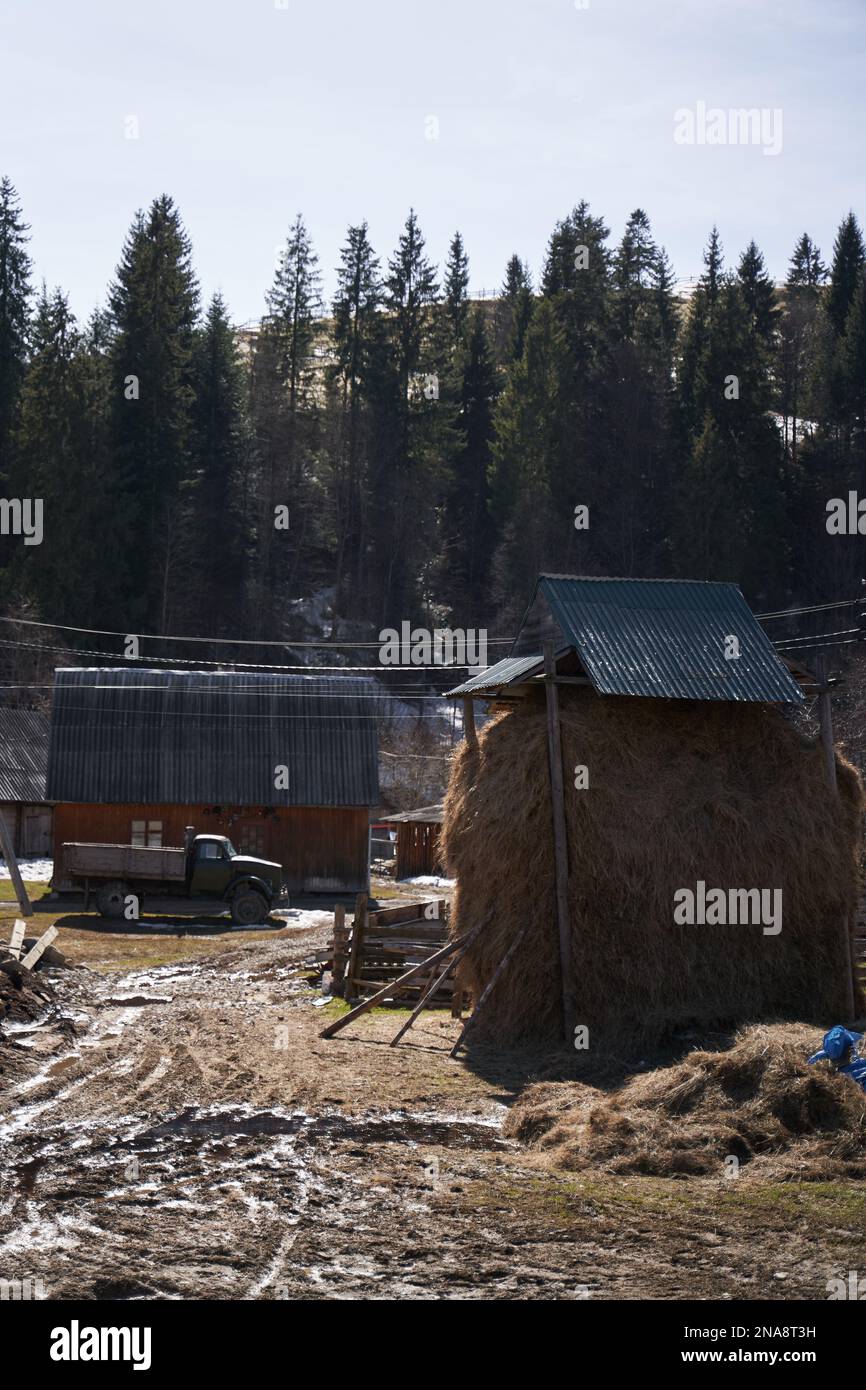 Village landscape mud yard and hay stack Stock Photo Alamy