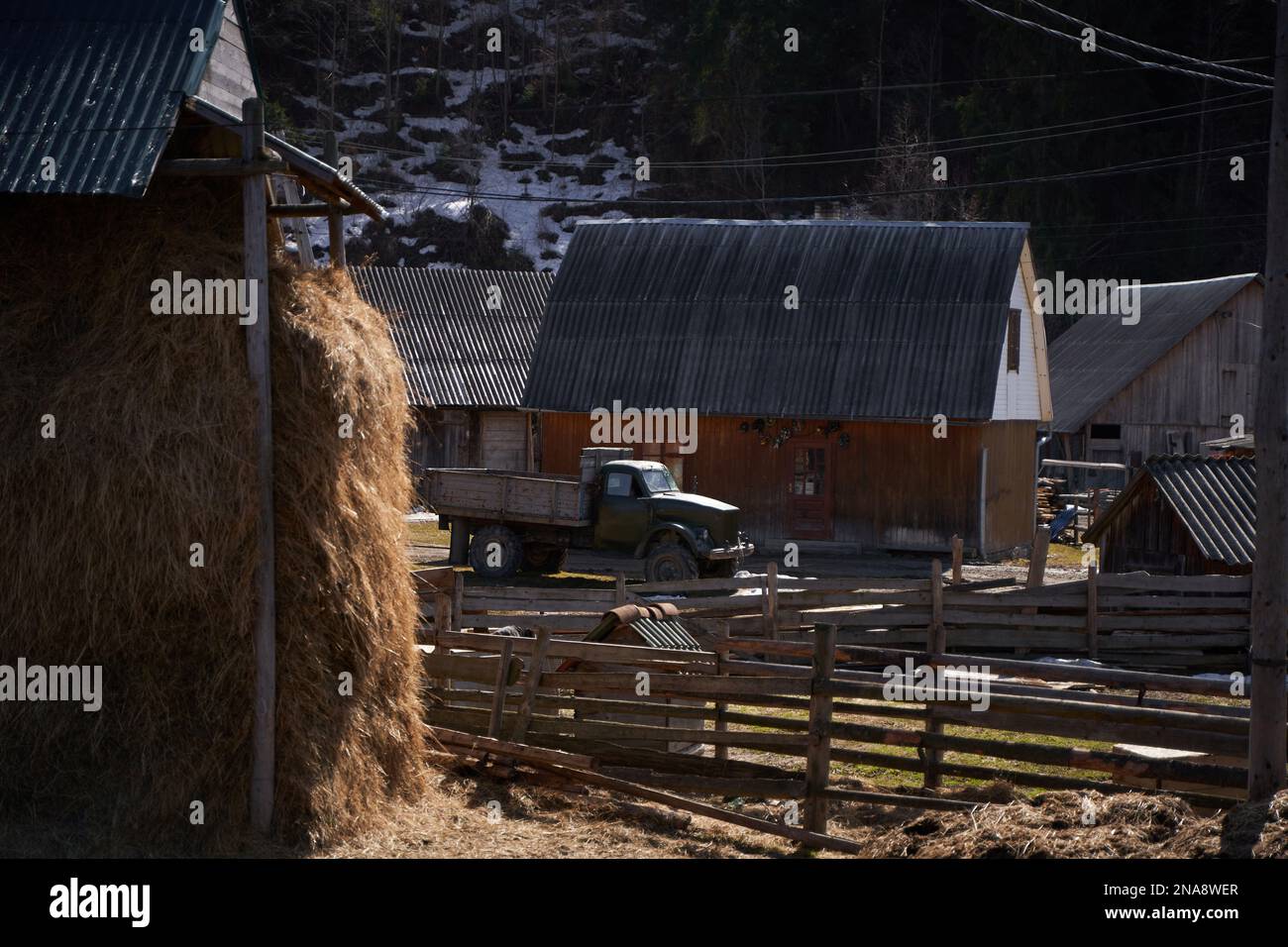 Village landscape mud yard and hay stack Stock Photo Alamy
