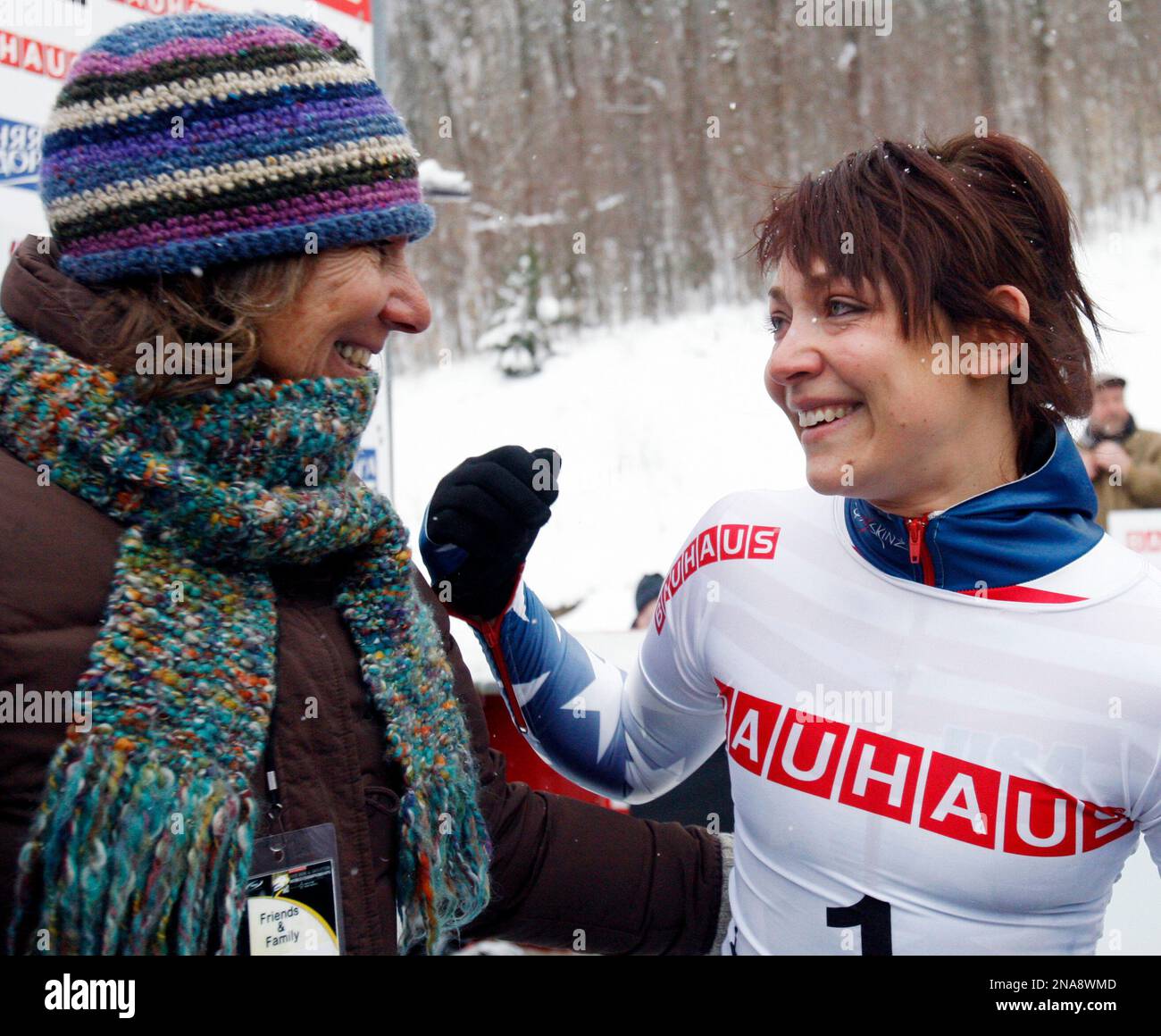 USA's Katie Uhlaender, right, reacts with her mother Karen after