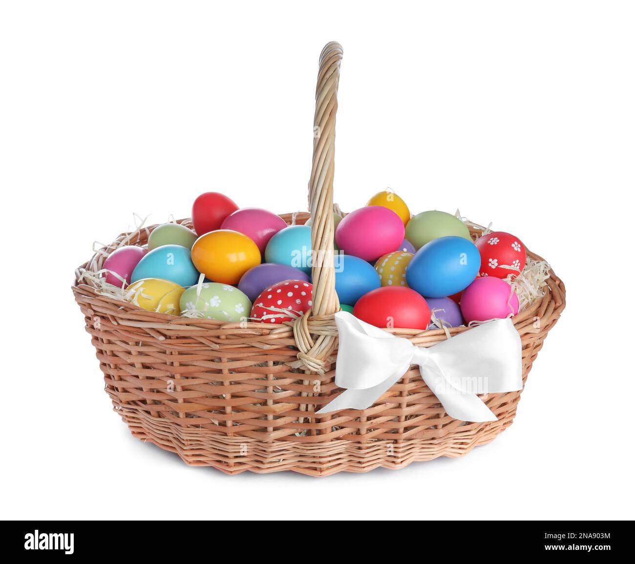 Wicker basket with bright painted Easter eggs on white background Stock ...
