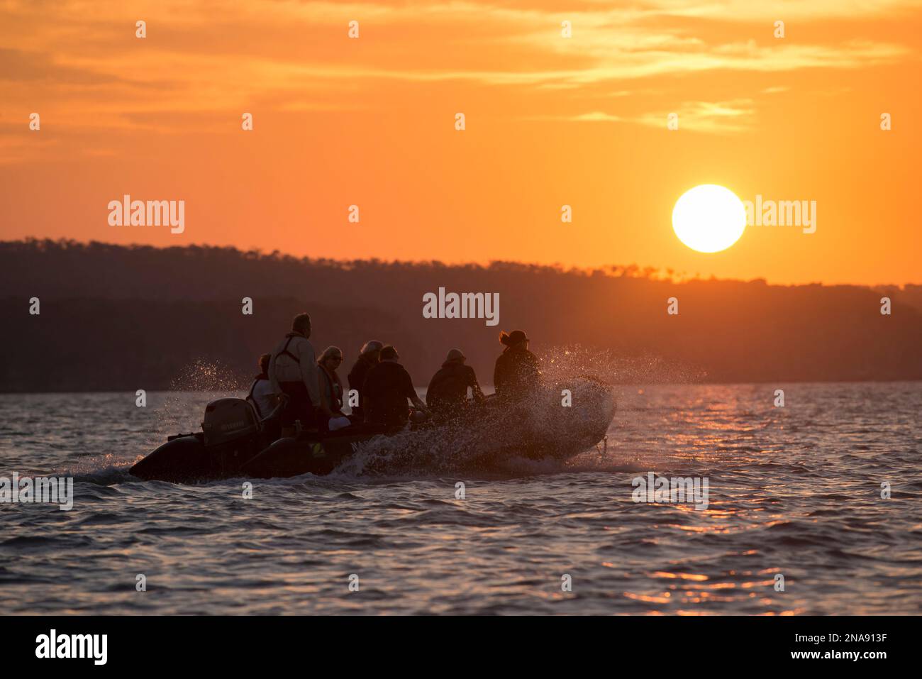 Expedition travelers aboard zodiac inflatable boats explore King George River in the Kimberley Region of Western Australia. Stock Photo