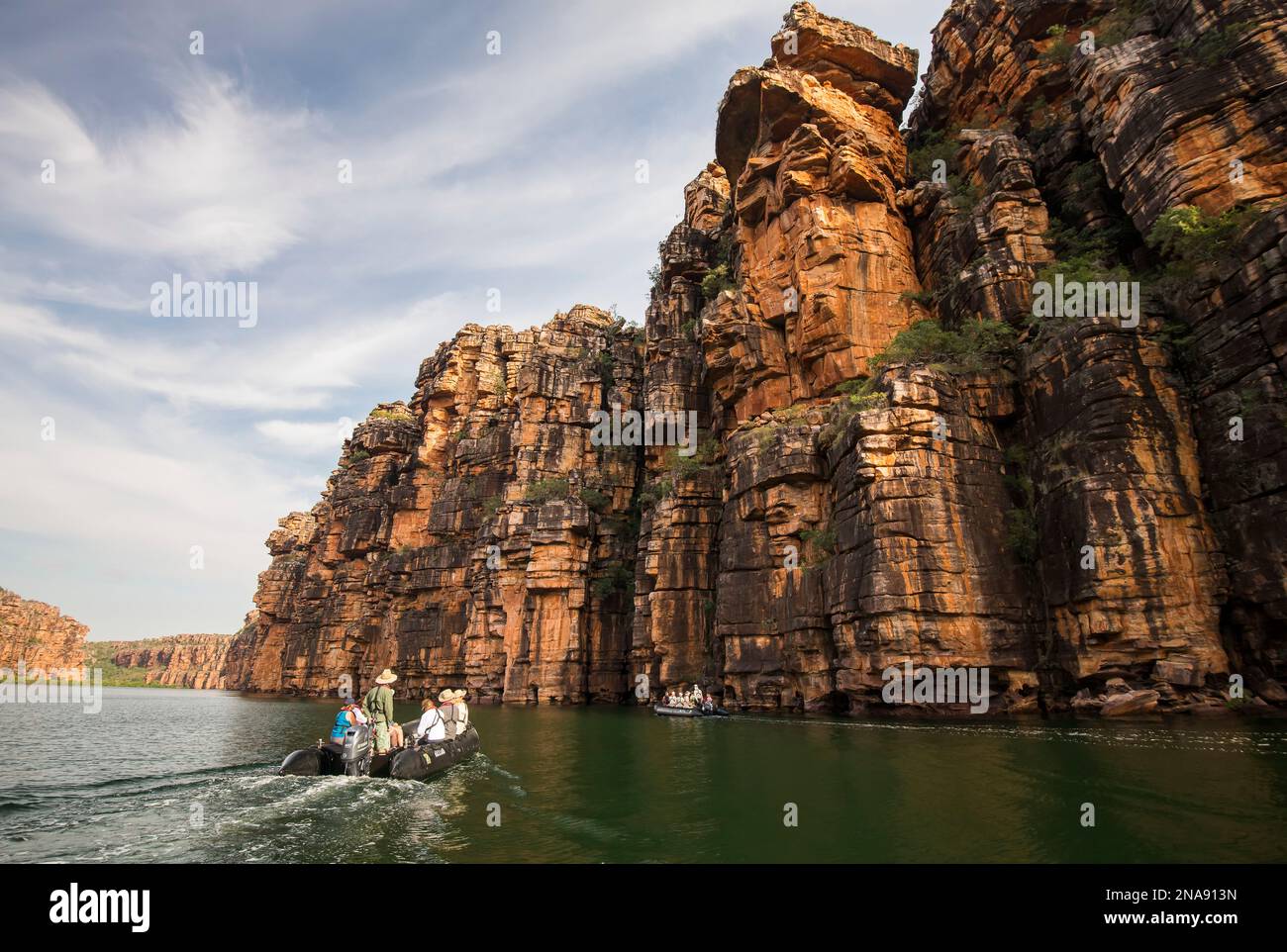 Expedition travelers aboard zodiac inflatable boats explore King George River in the Kimberley Region of Western Australia. Stock Photo