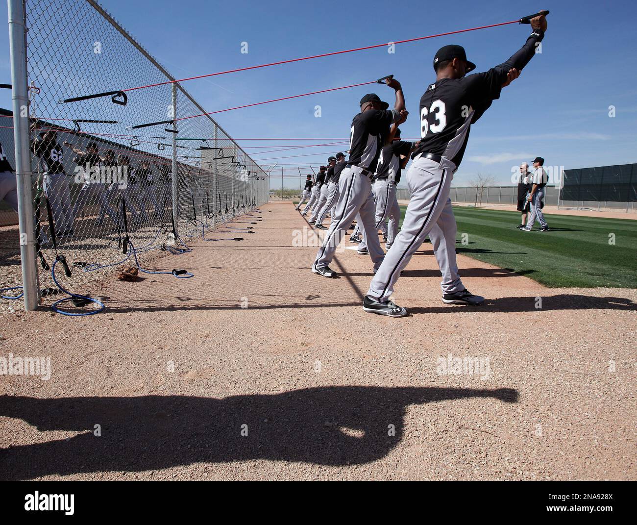 Chicago White Sox pitchers warm up during a spring training baseball  workout in Goodyear, Ariz., Thursday, Feb. 23, 2012. (AP Photo/Jae C. Hong  Stock Photo - Alamy