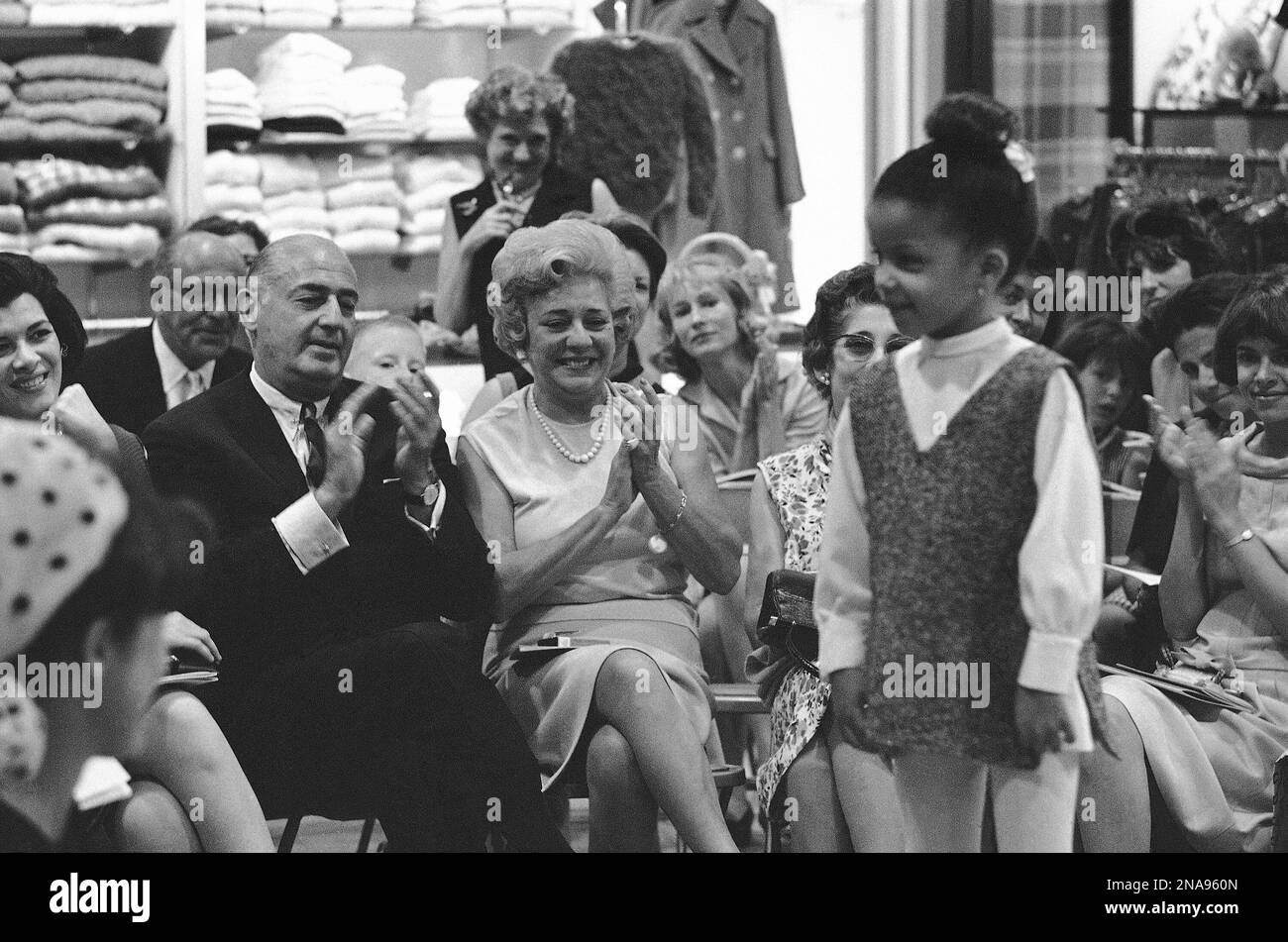 At Bergdorf Goodman, northernmost of the big specialty shops which give New  York's Fifth Avenue its fashion prestige, Andrew Goodman and his wife Nena  applaud a model at a fashion show of