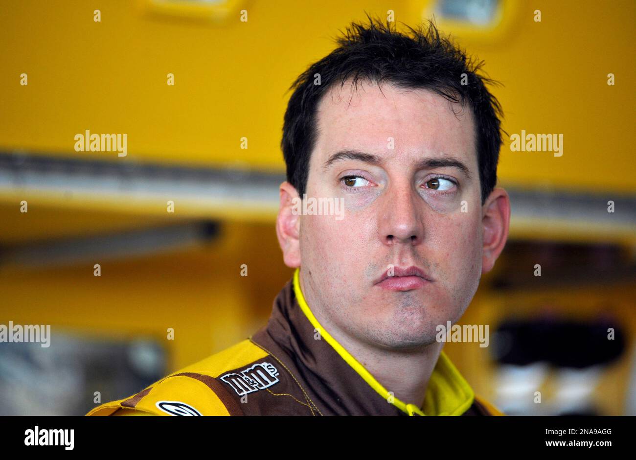 Kyle Busch looks out of the garage area before practice for Sunday's