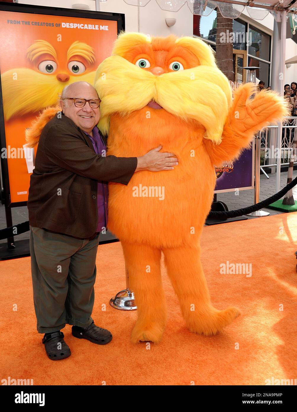 Actor Danny DeVito and The Lorax arrive at the premiere of the animated ...