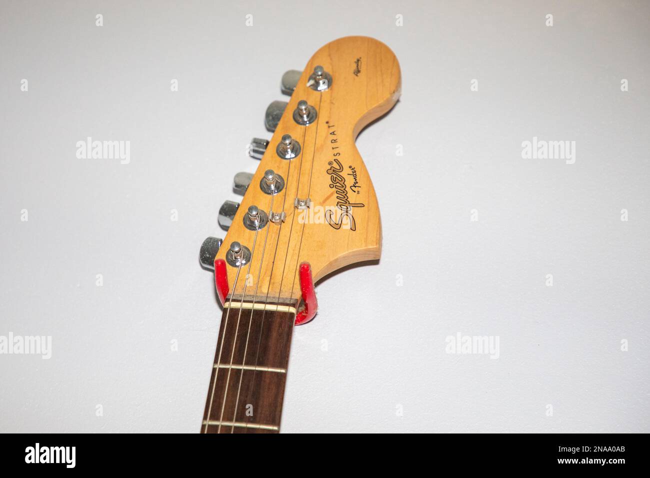 Bordeaux , Aquitaine  France - 06 02 2023 : Fender squier strat Guitar brand logo and text sign electric guitar head detail Stock Photo
