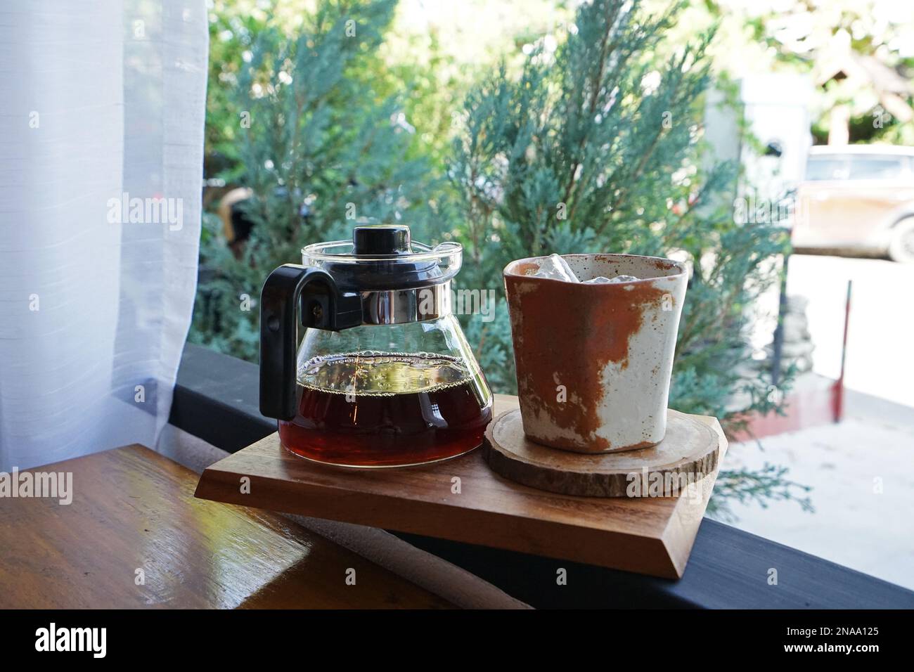 Close up cold drip coffee with ceramic clay cup Stock Photo