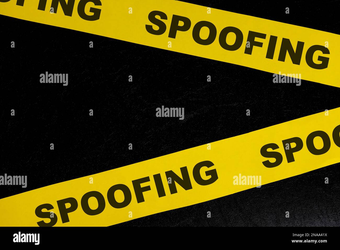 Spoofing cybercrime alert, caution and warning concept. Yellow barricade tape with word spoofing in dark black background. Stock Photo