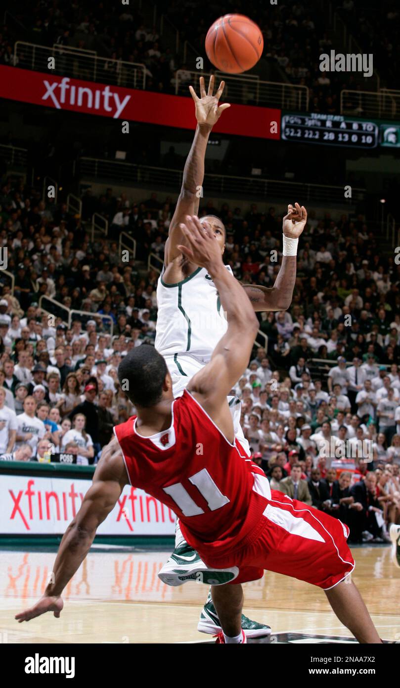 Michigan State's Keith Appling shoots over Wisconsin's Jordan Taylor