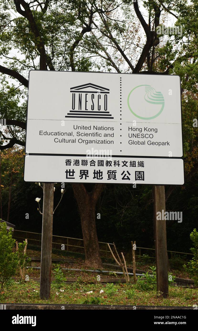 A sign of the UNESCO Global Geopark in Sai Kung East Country Park in Hong Kong. Stock Photo