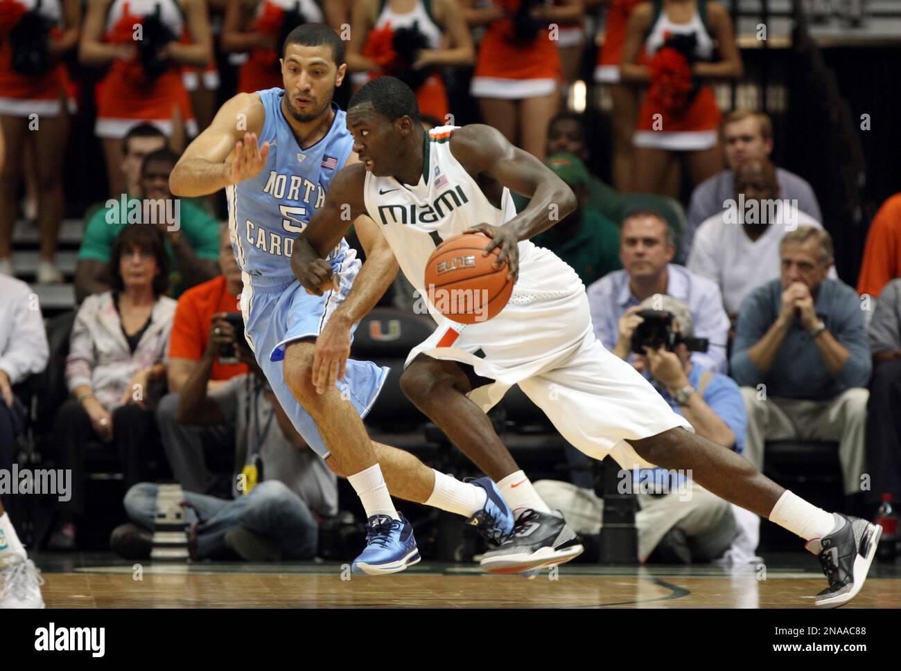 Miami's Durand Scott, right, drives to the basket as North Carolina's
