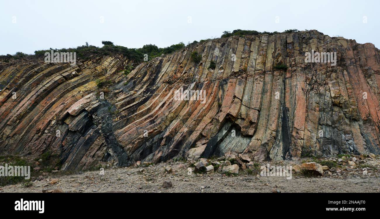 Early Cretaceous rhyolitic columnar rock formation located in the UNESCO Global Geopark in Sai Kung East Country Park in Hong Kong. Stock Photo