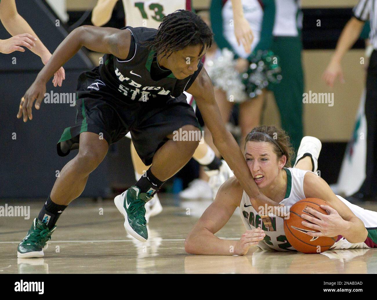 Wisconsin-Green Bay's Julie Wojta pulls in a loose balls as Wright