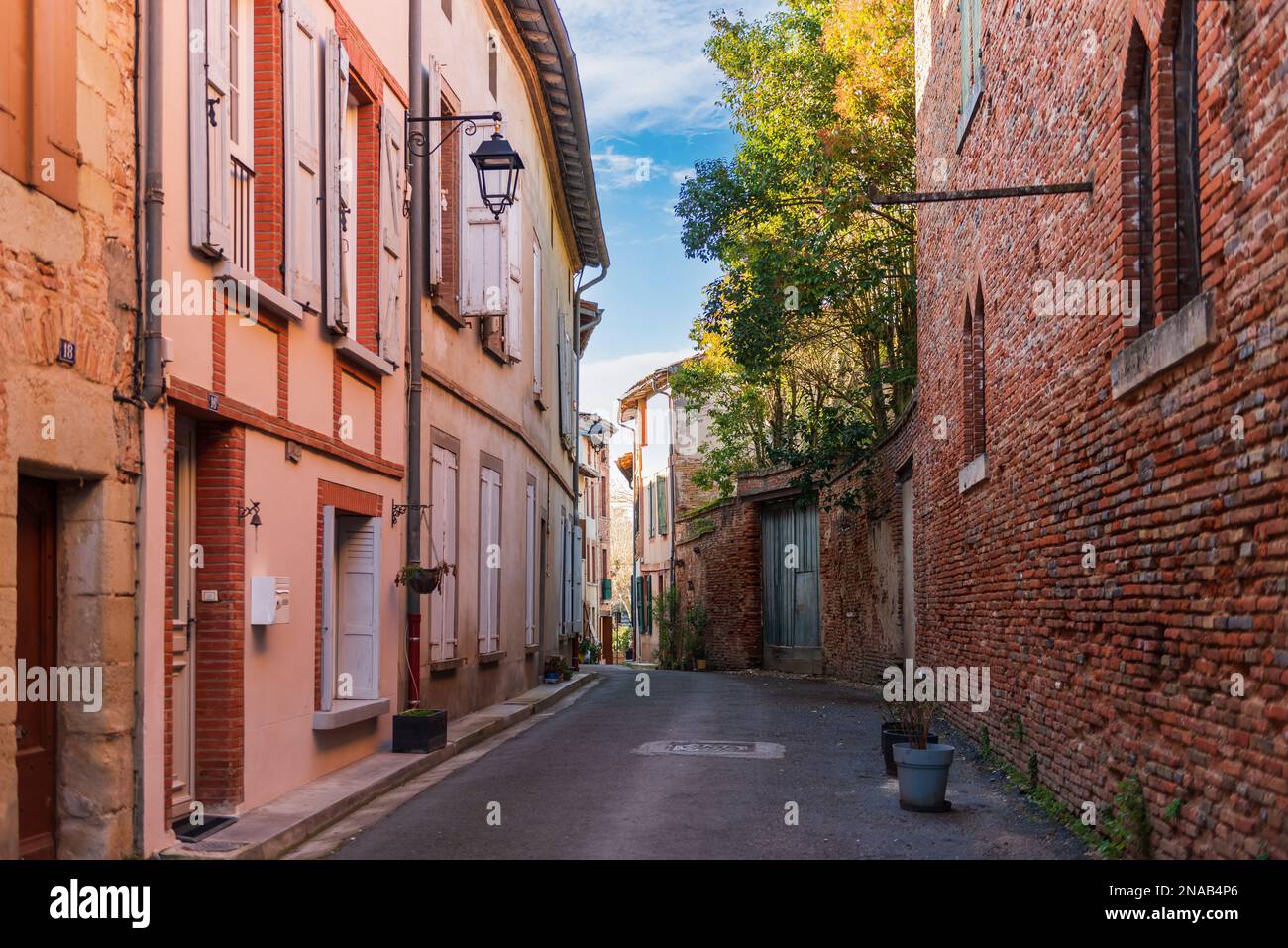 Small narrow street in the town of Rabastens, in Tarn, Occitanie, France Stock Photo