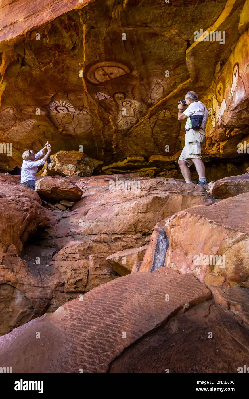 Photographers, Raft Point, Wandjina Art Site, Aboriginal Rock Art, Kimberley Region, Northwest Australia Stock Photo