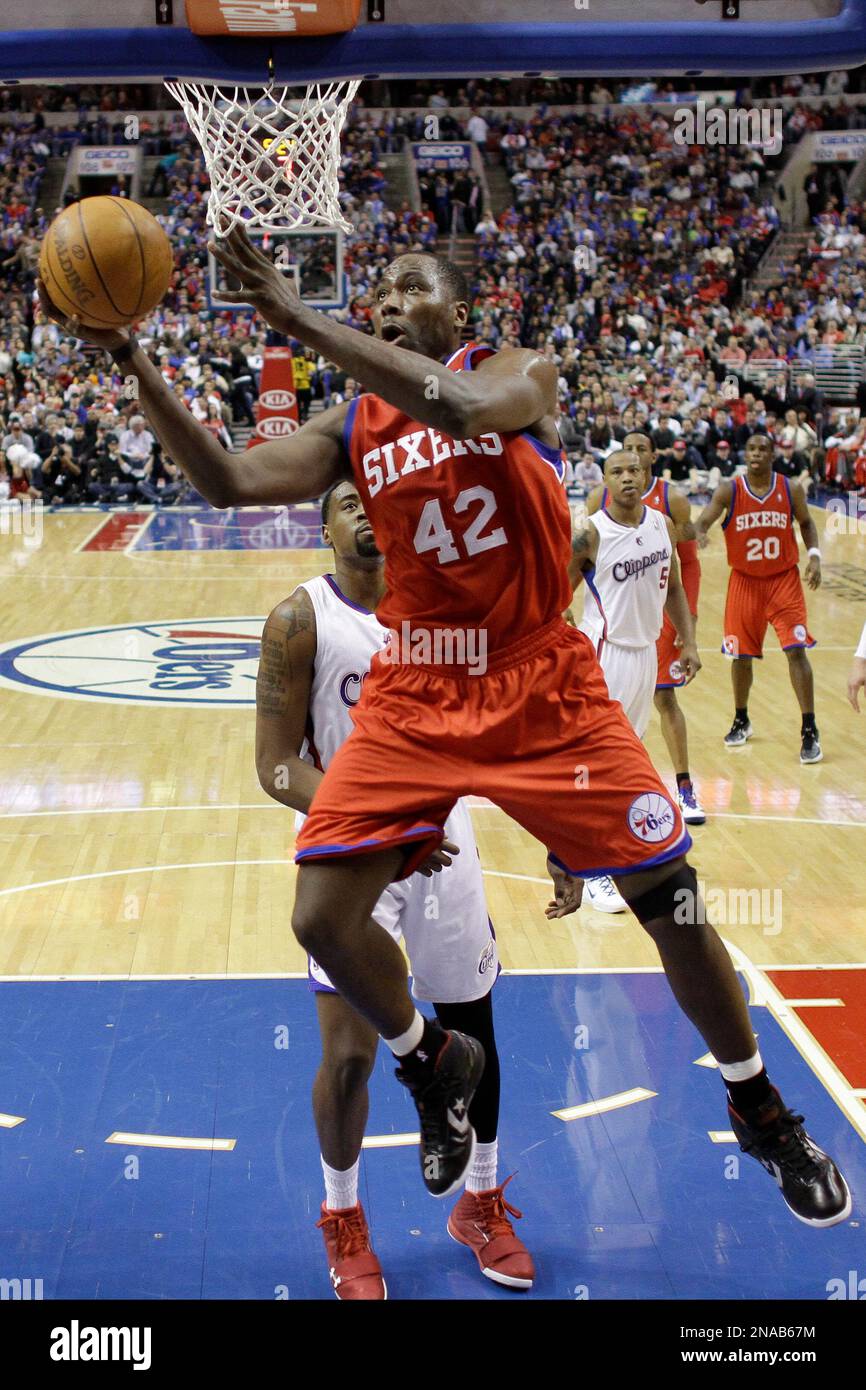 Philadelphia 76ers' Steven Hunter, right, blocks the shot of Los Angeles  Clippers' Cuttino Mobley (5) as teammate Elton Brand, left, looks on during  the first half of a NBA basketball game in