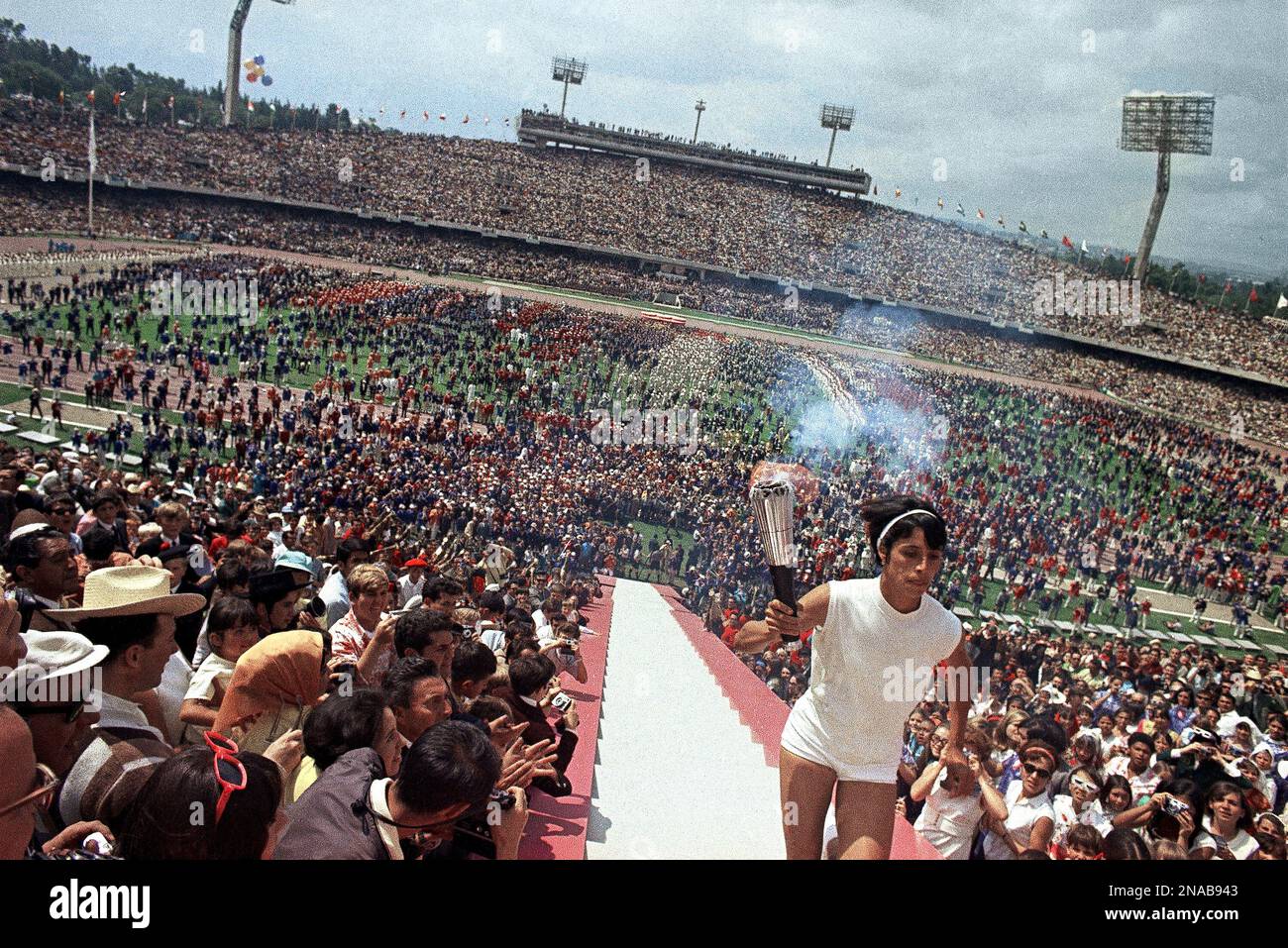 Enriqueta Basilio carries the Olympic torch up the 90 steps to the ...