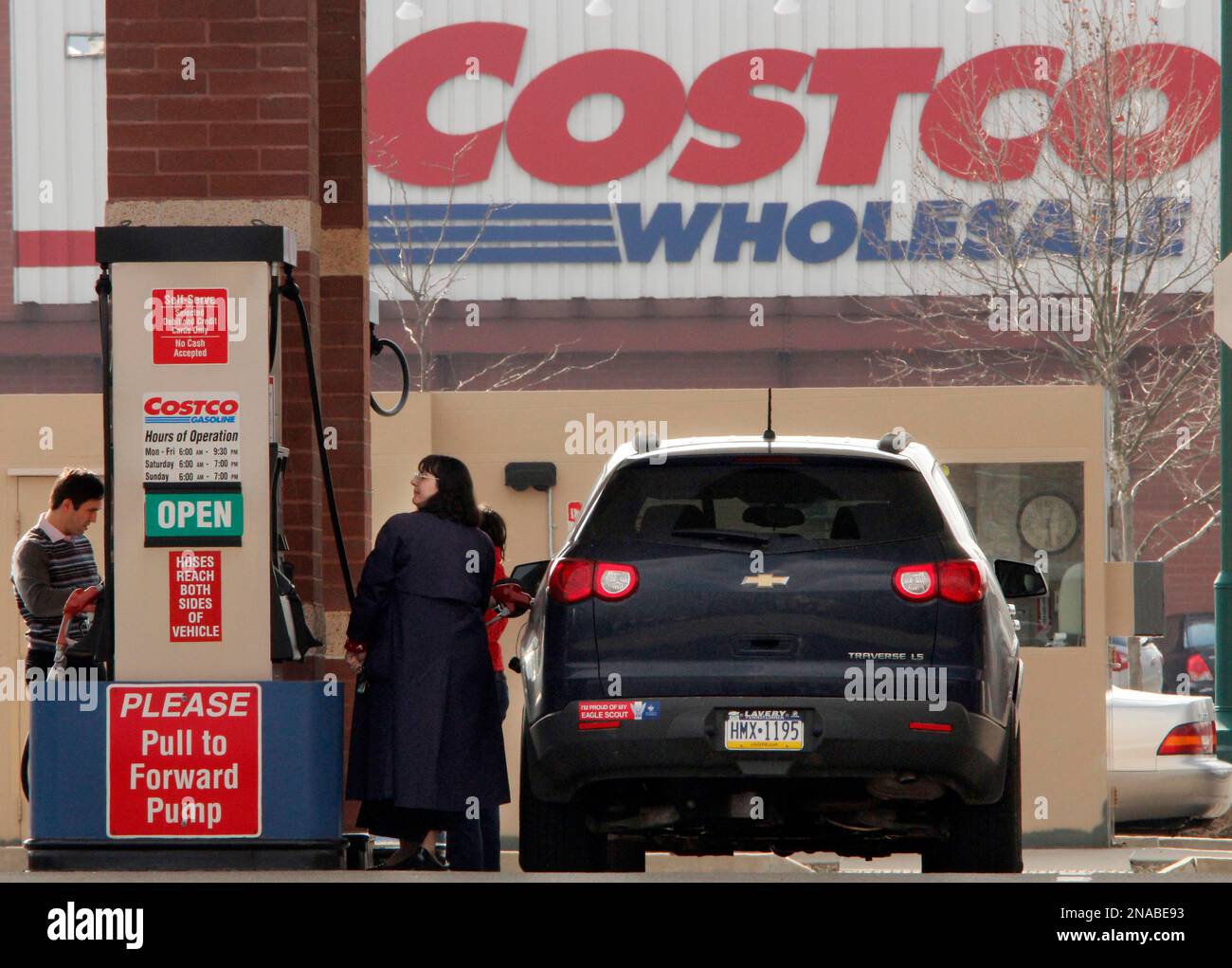 In this Feb. 7, 2012 photo, Costco members pump gas outside a Costco
