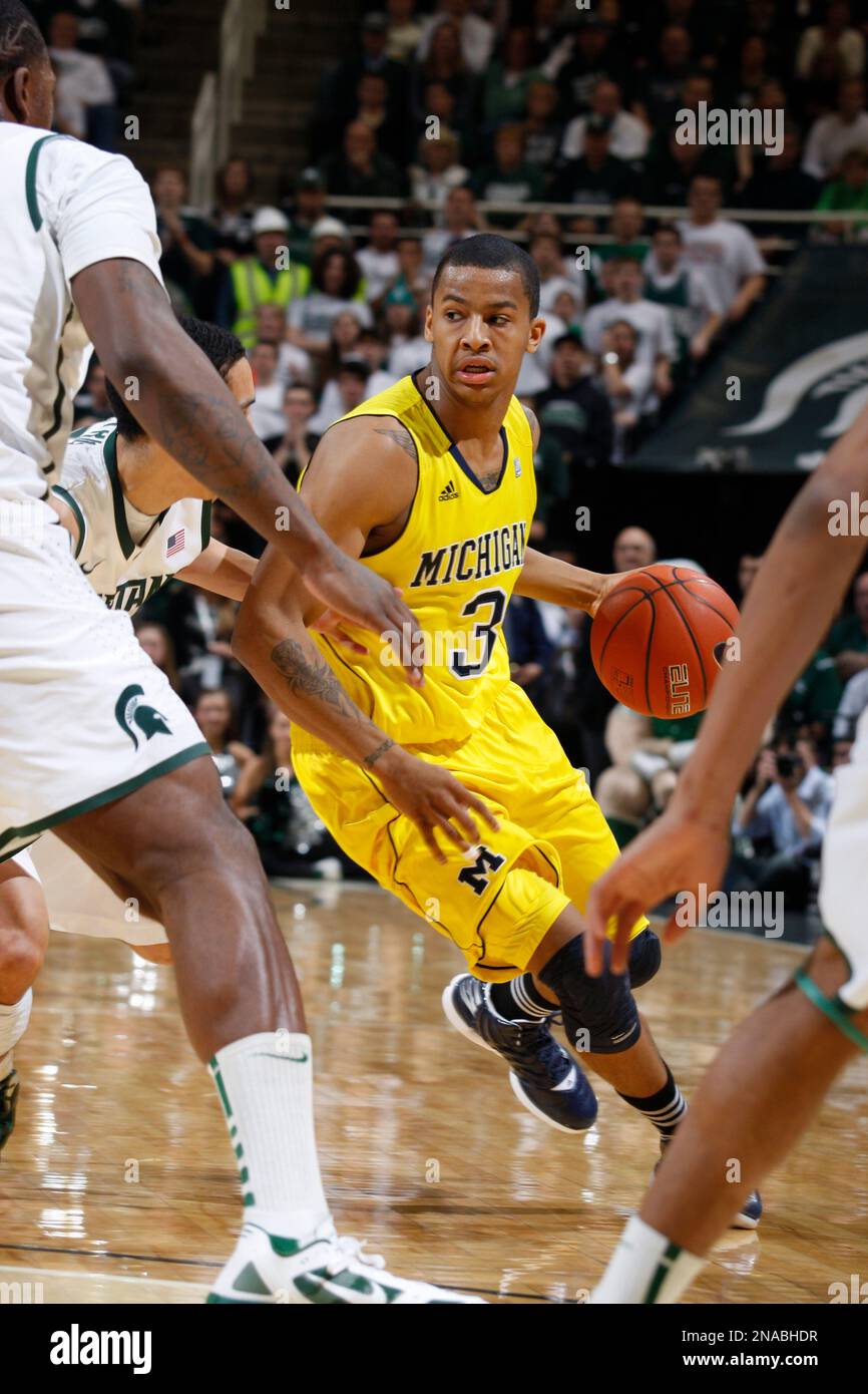 Michigan's Trey Burke (3) Drives During An NCAA College Basketball Game ...