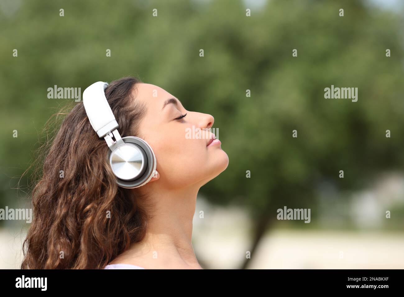 Woman with headphones meditating hi-res stock photography and images ...