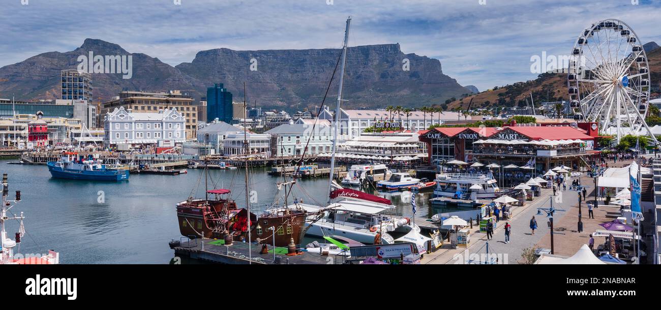 Ferris wheel, shops, restaurants and harbour at Victoria and Alfred Waterfront in Cape Town; Cape Town, South Africa Stock Photo