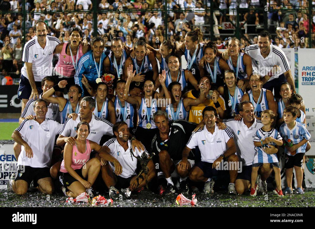 Argentina's team members celebrate as they pose for pictures at the end