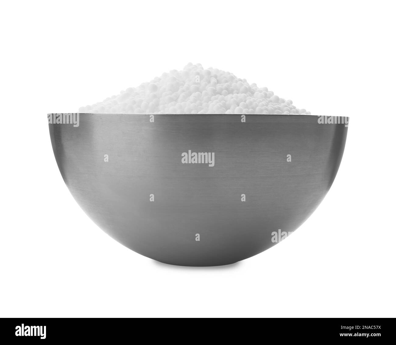 Pellets of ammonium nitrate in bowl isolated on white. Mineral fertilizer Stock Photo