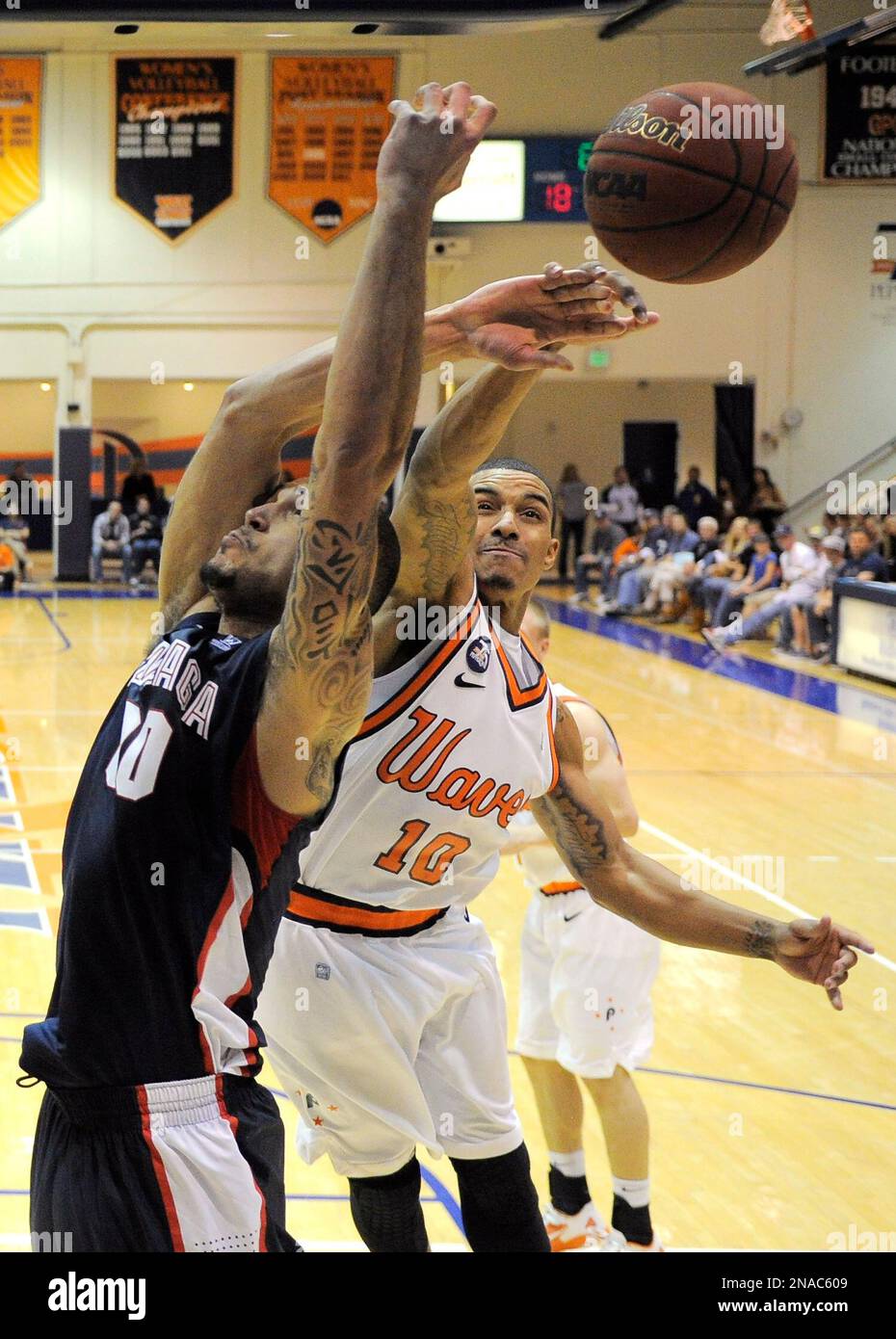 Pepperdine guard Joshua Lowery, right, rejects a shot by Gonzaga center