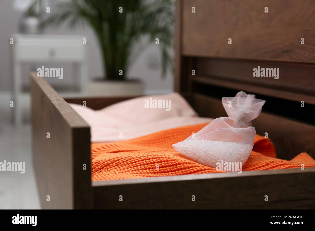 Scented sachet and folded clothes in drawer Stock Photo Alamy