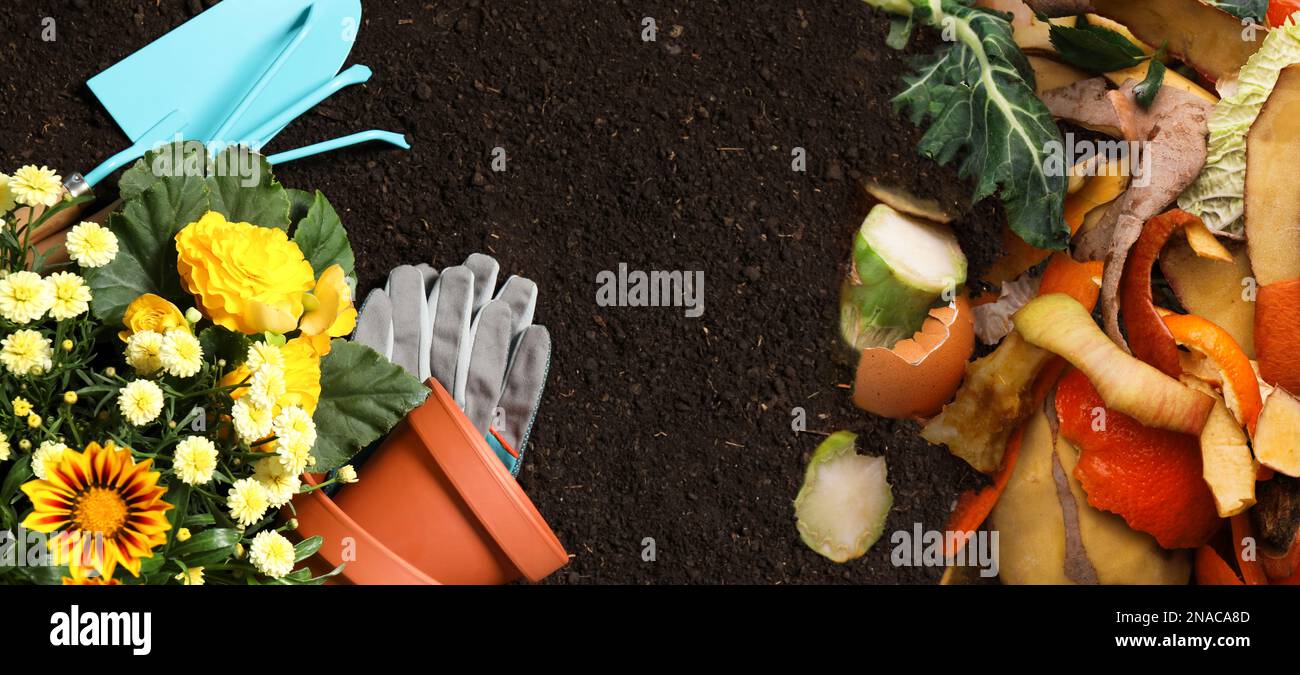 Gardening tools, flowers and organic waste for composting on soil, flat
