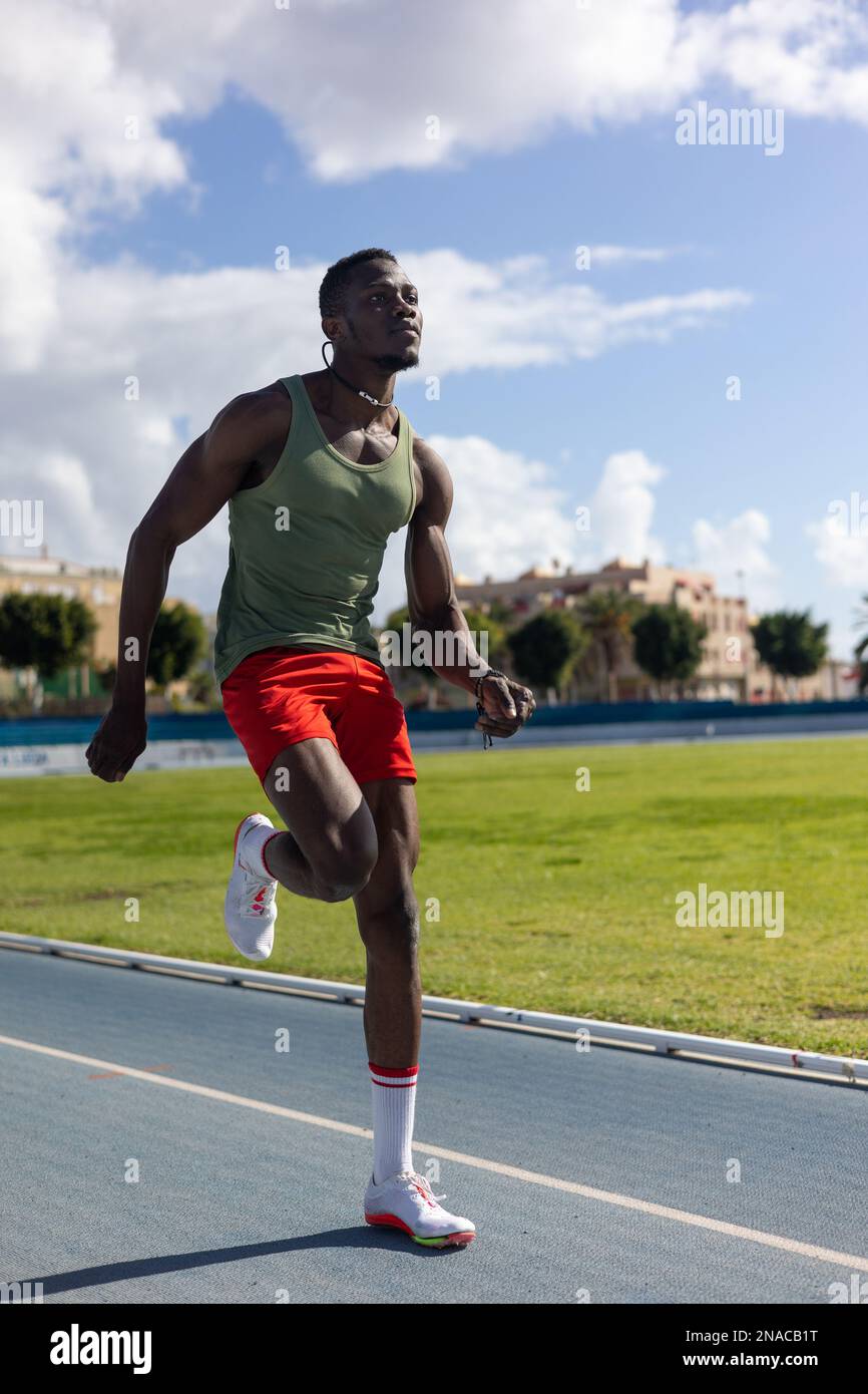 african man running on athletics track Stock Photo Alamy