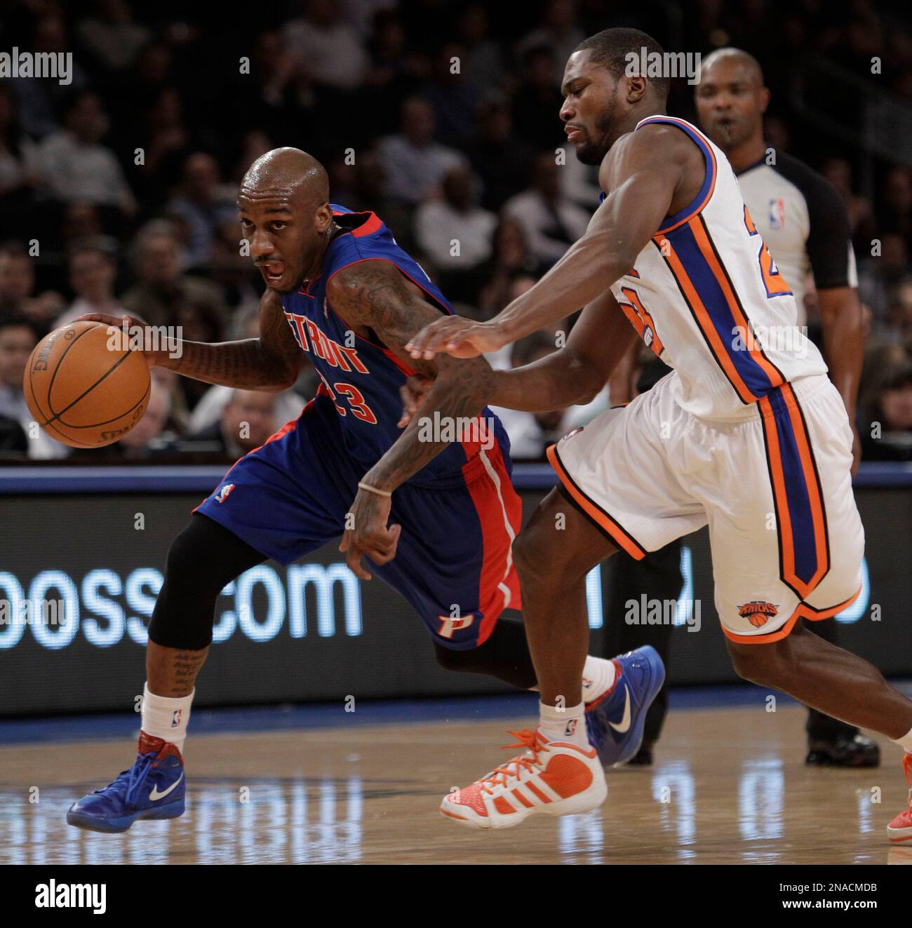 Detroit Pistons guard Walker Russell (23) drives past New York Knicks