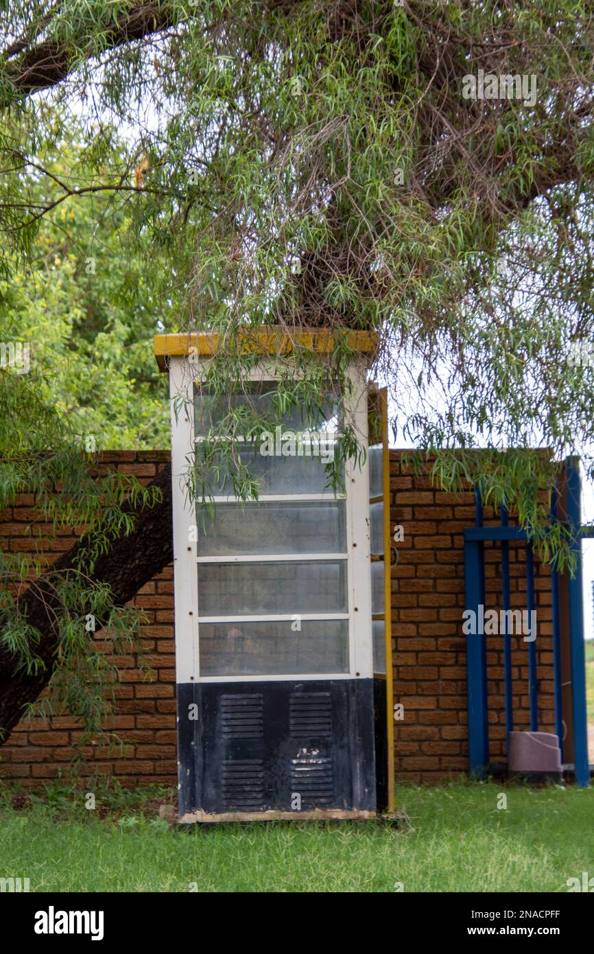 Abandoned phone booth isolated Stock Photo - Alamy