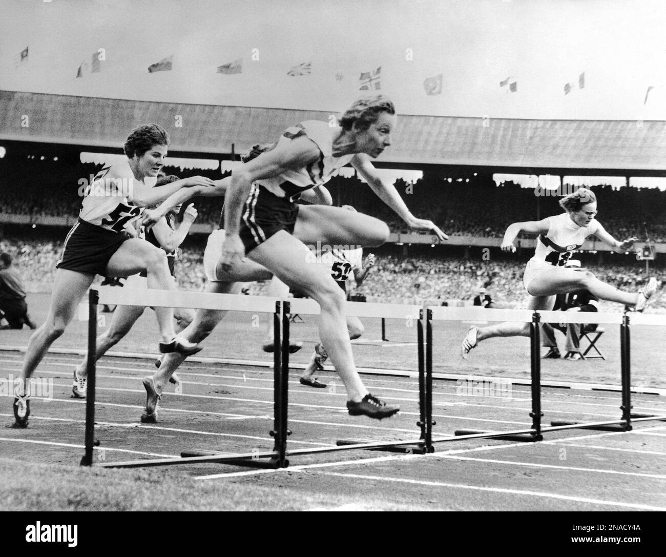 Jumping over the last hurdle at the Women's 80 meters Summer Olympic