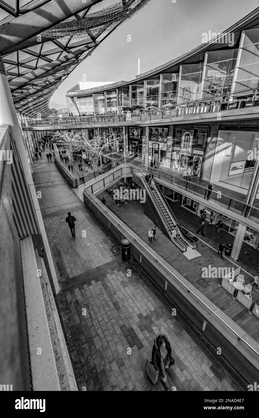 A vertical grayscale shot inside Liverpool One Shopping Centre