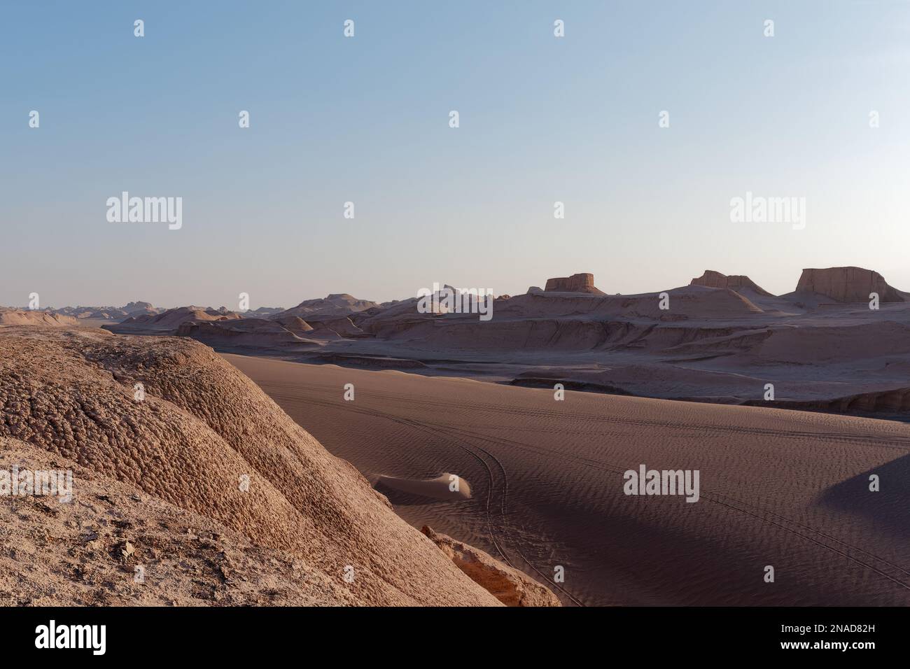 Empty desert under clear blue sky, serene landscape with sand dunes and ...