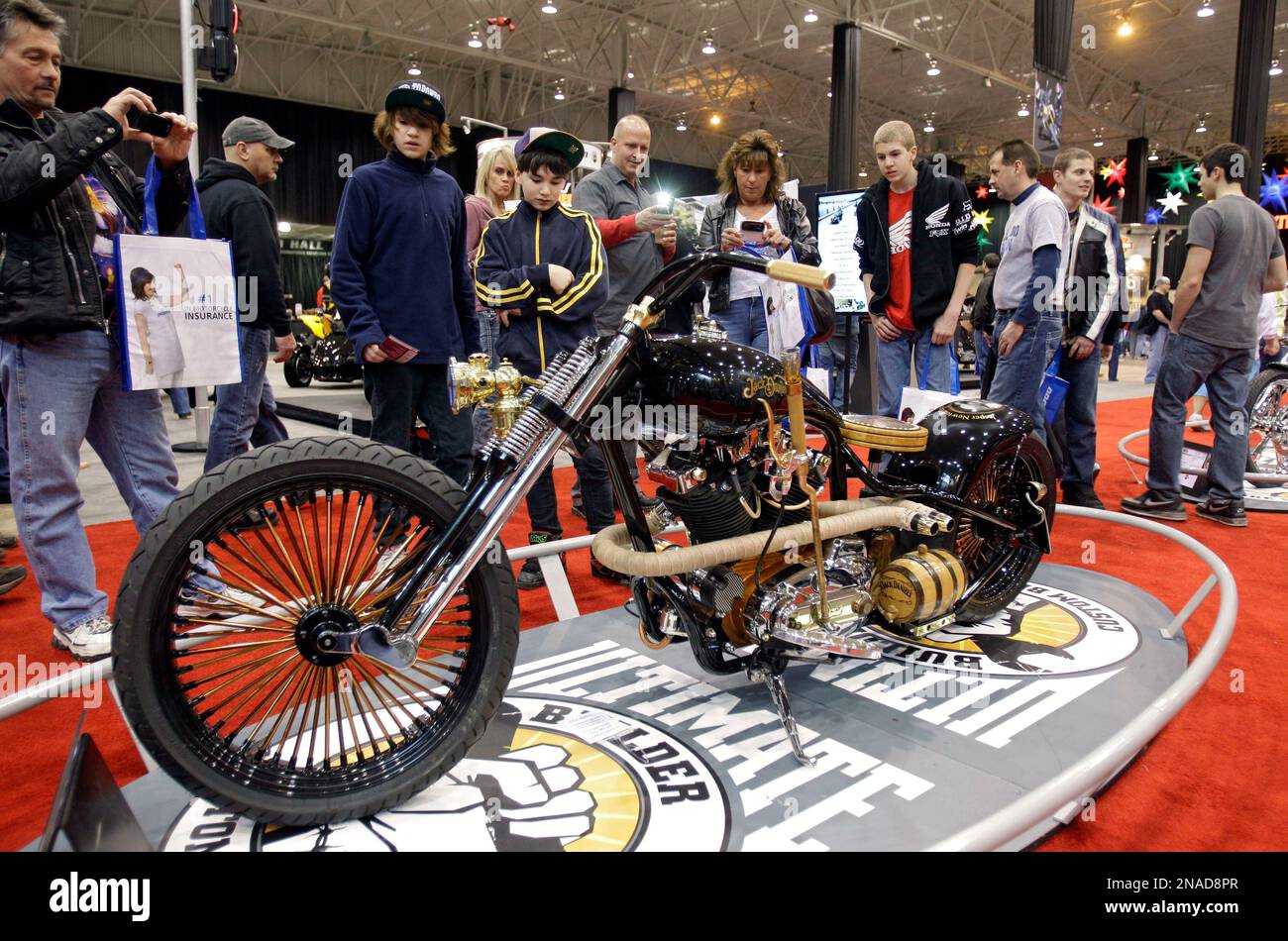 https://c8.alamy.com/comp/2NAD8PR/visitors-photograph-the-whiskey-bent-custom-mororcycle-at-the-progressive-international-motorcycle-show-at-the-i-x-center-in-cleveland-sunday-jan-29-2012-the-jack-daniels-themed-bike-was-built-by-jon-shipley-of-hoosier-daddy-choppers-in-indiana-ap-photomark-duncan-2NAD8PR.jpg