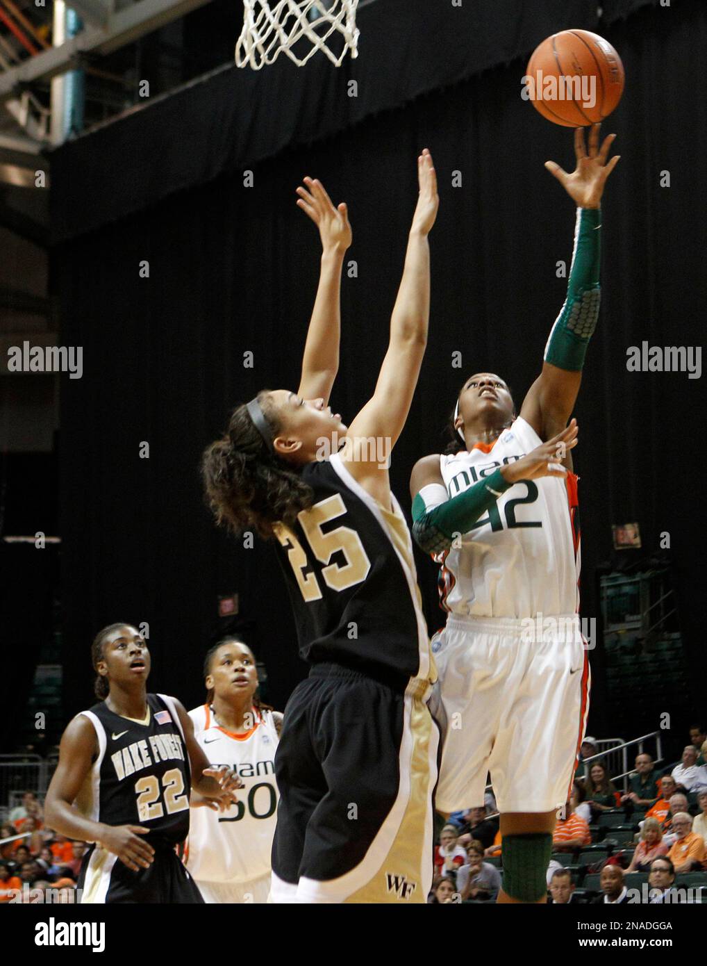 Miami's Shenise Johnson (42) shoots over Wake Forest's Dearica Hamby