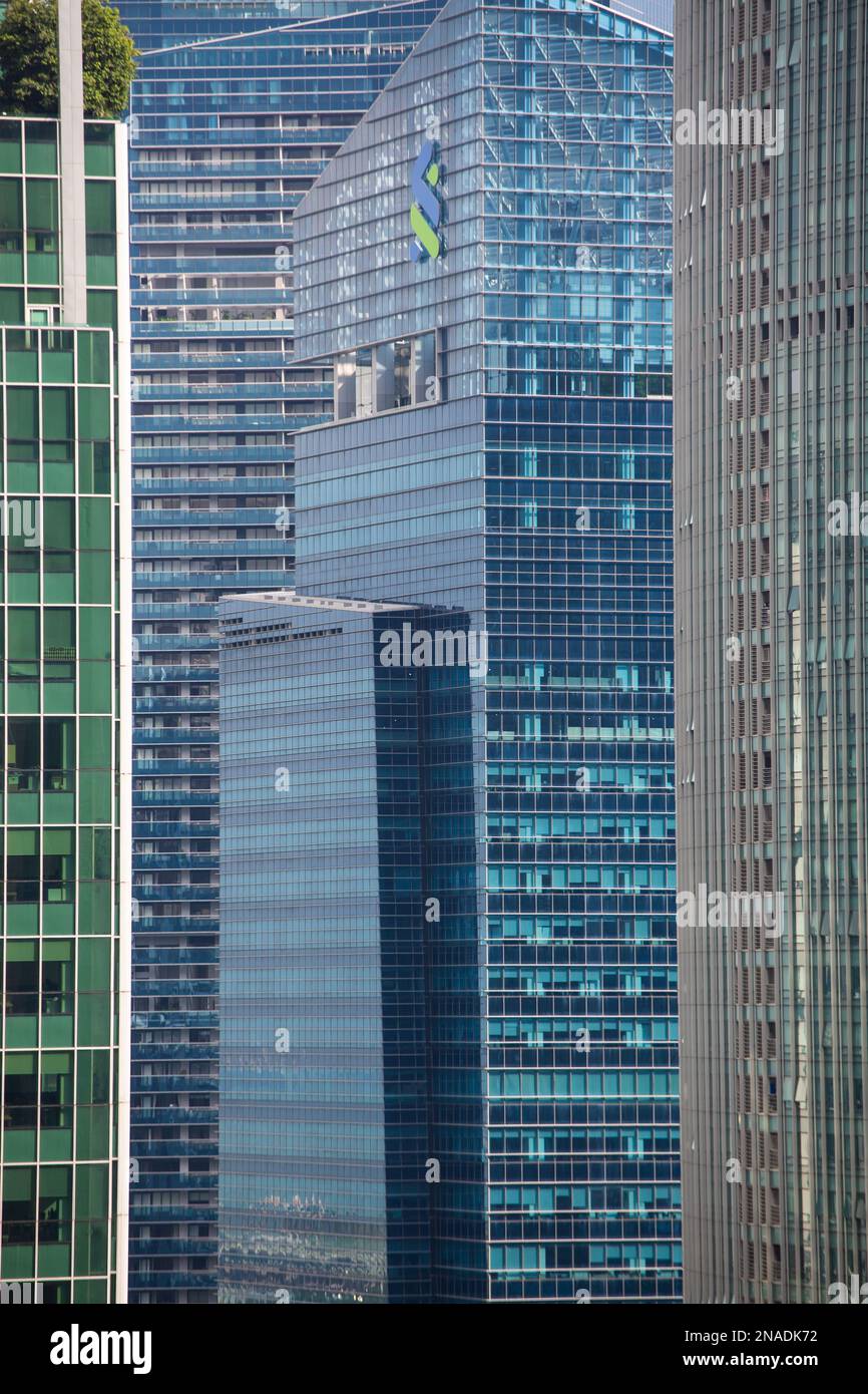 Close up vertical side view of Standard Chartered bank logo at Marina