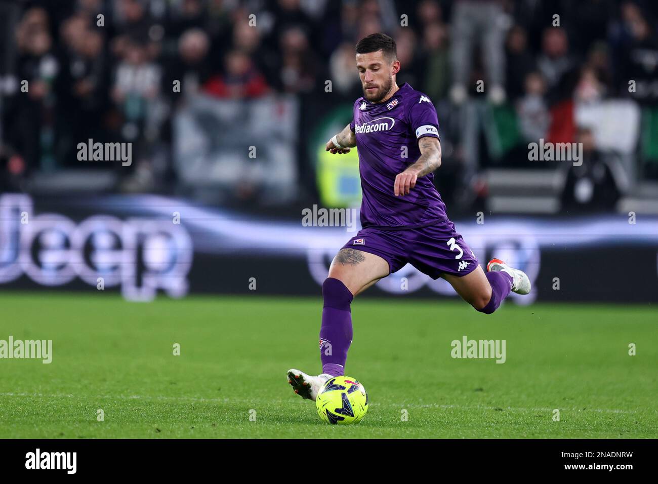 Dusan Vlahovic of Juventus and Christiano Biraghi of Acf Fiorentina during  the Italian serie A, football match between Juventus Fc and Acf Fiorentina  on 12 February 2023 at Allianz Stadium, Turin, Italy.