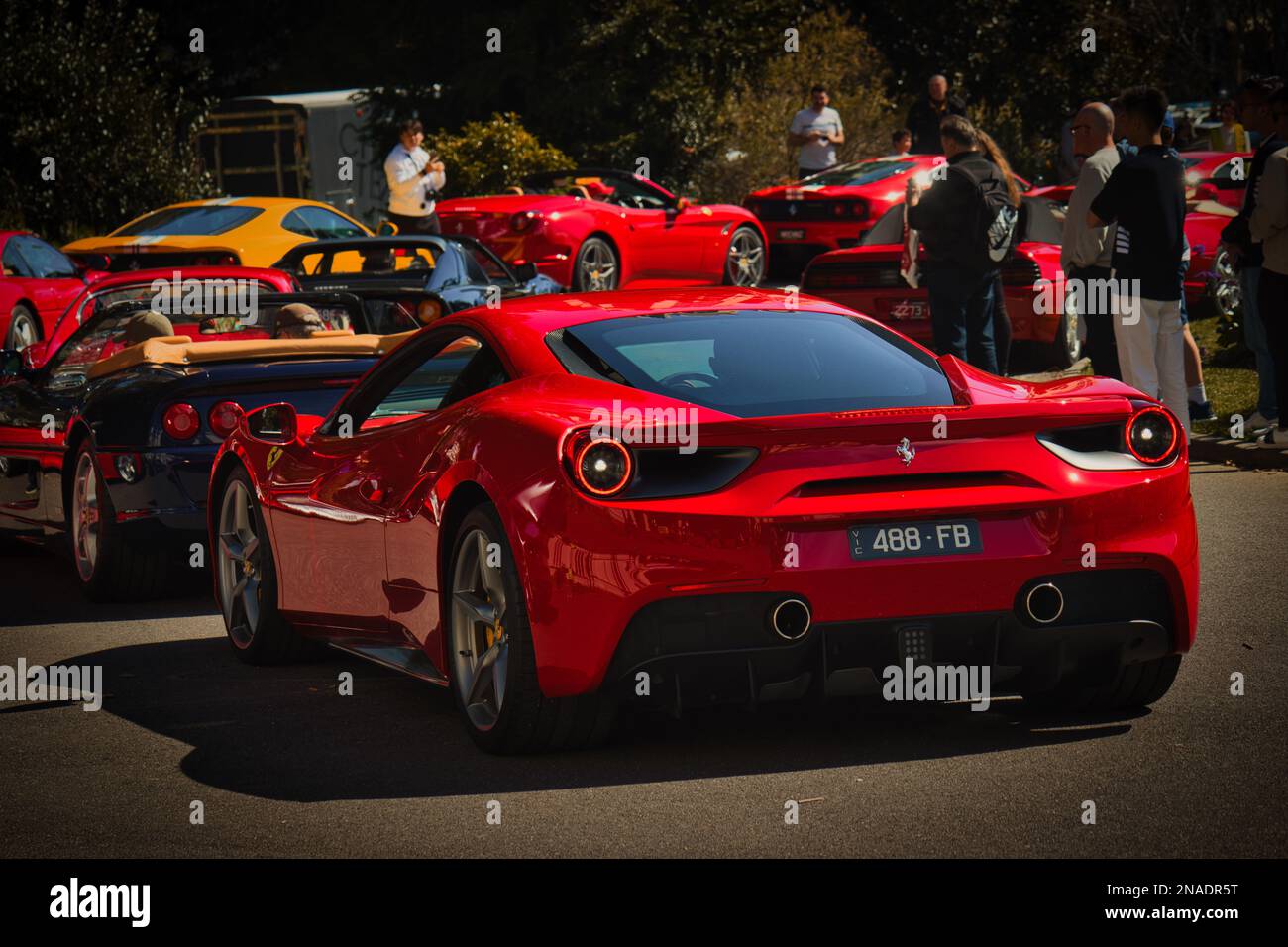 The red Ferrari super car in Melbourne with people outside the Royal ...