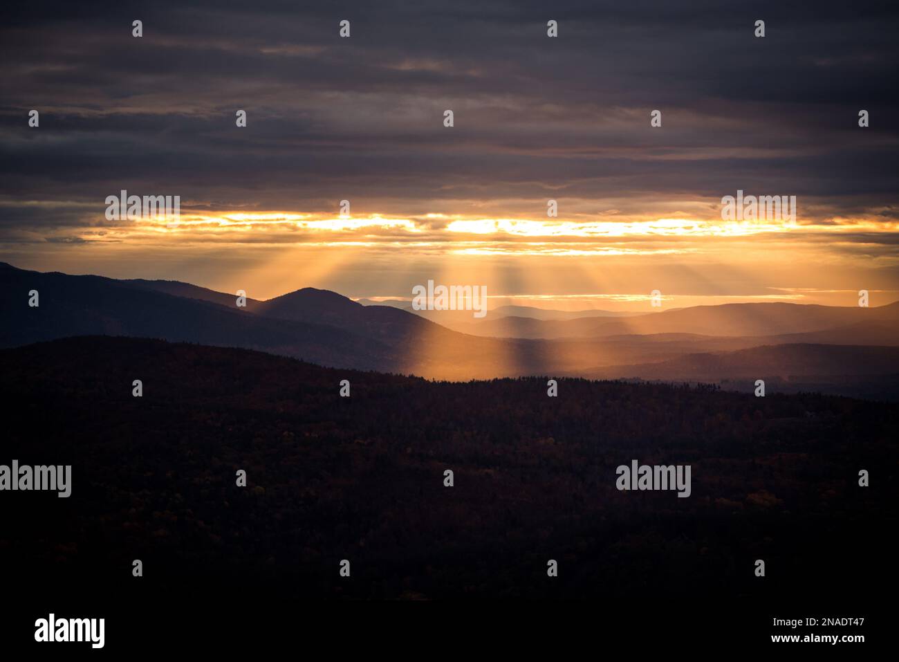 Sunset sun rays at golden hour in White Mountains Stock Photo