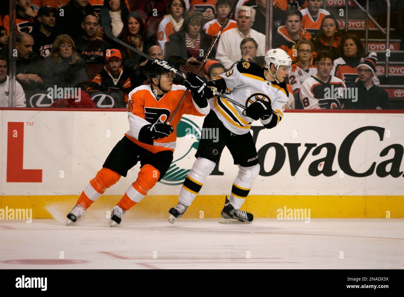 Philadelphia Flyers' Erik Gustafsson (26)left, And Boston Bruins' Tyler ...