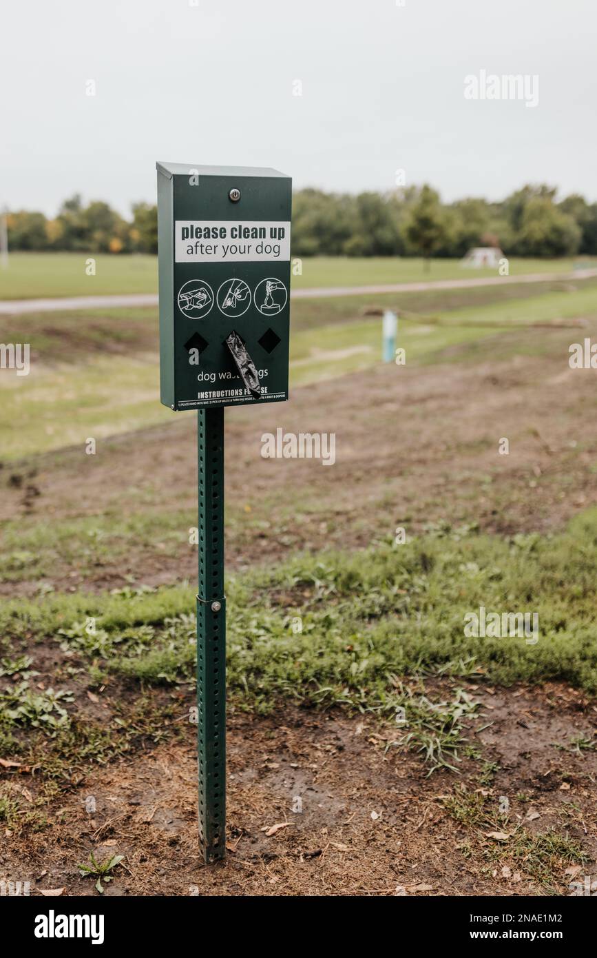 Portrait of a dog waste station at along local walking trail Stock