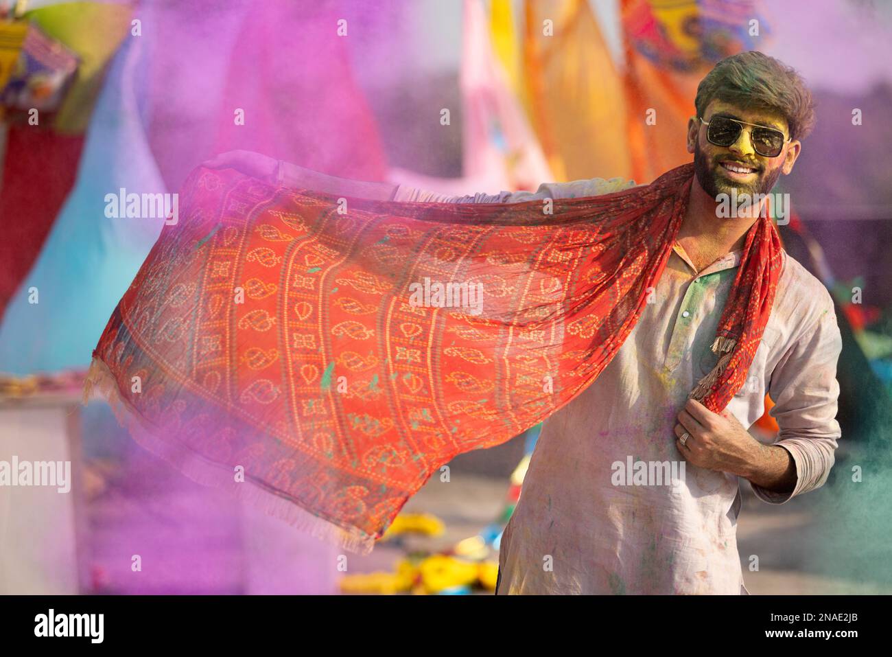 man playing holi and dancing with gulal on his face Stock Photo