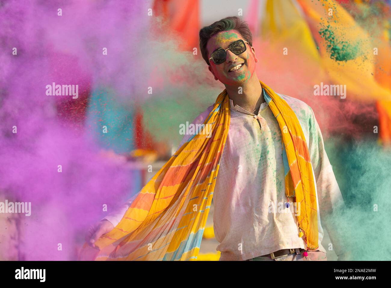 man playing holi and dancing with gulal on his face Stock Photo
