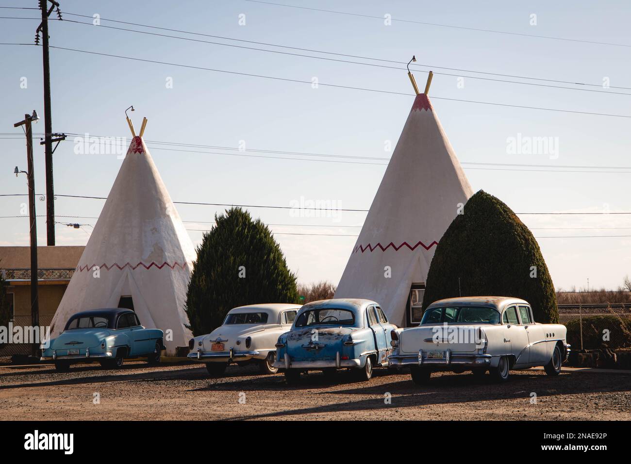 Rusty Classic Cars Parked in front of Teepees at the Wigwam Motel Stock Photo