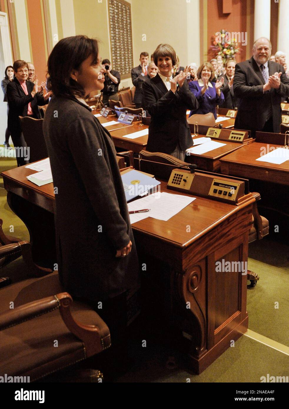 Minnesota House members applaud as their newest representative, Rep. Susan Allen, DMinneapolis